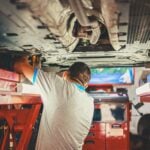 Mechanic fixing car